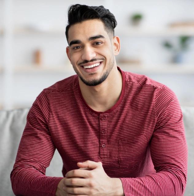 Patient showing results of teeth whitening treatment